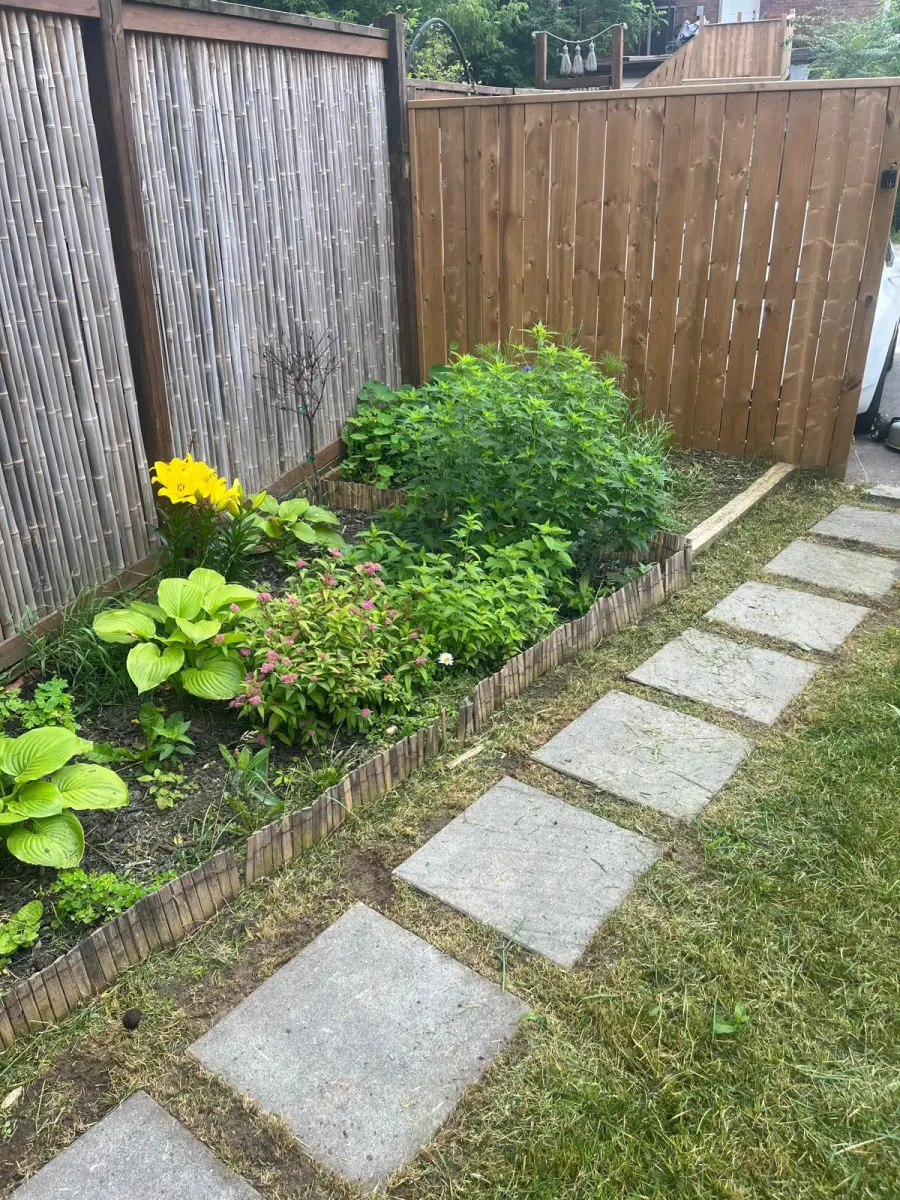 Garden bed with stone-paver path and edging stones